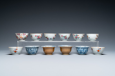 Twenty-two Chinese blue and white and famille rose cups and nineteen saucers, Kangxi and later