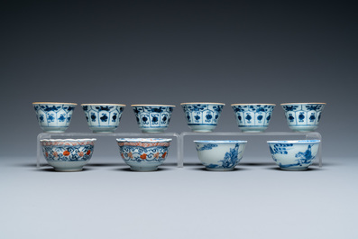 Twenty-two Chinese blue and white and famille rose cups and nineteen saucers, Kangxi and later