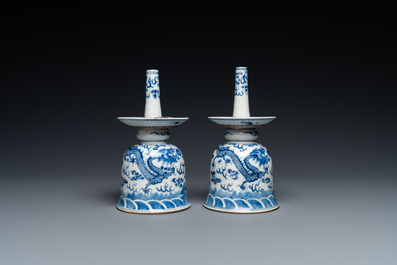 A pair of Chinese blue and white 'dragon' candlesticks, 19th C.