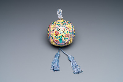 A Chinese reticulated famille rose fragrance ball, 19th C.