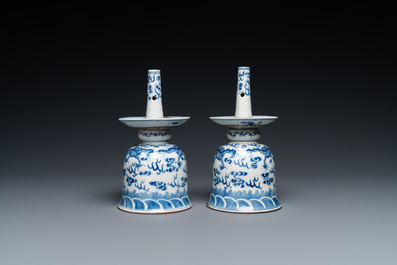 A pair of Chinese blue and white 'dragon' candlesticks, 19th C.