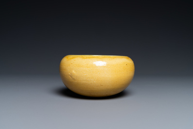 A Chinese monochrome yellow alms bowl with green interior, Kangxi