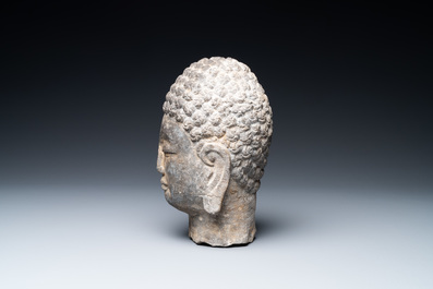 A Chinese stone carving of a Buddha head, Ming