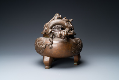 A large Chinese dragon-handled bronze tripod censer and cover, Xuande mark, 18/19th C.