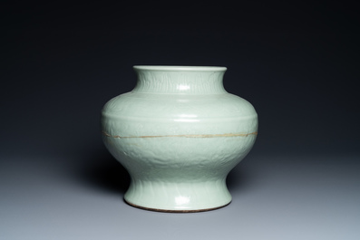 Een Chinese monochrome celadon vaas met onderglazuur floraal decor, Chenghua merk, Kangxi