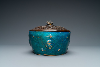 A Chinese monochrome turquoise-glazed bowl with reticulated wooden cover, Ming