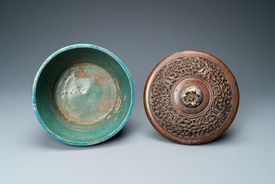 A Chinese monochrome turquoise-glazed bowl with reticulated wooden cover, Ming