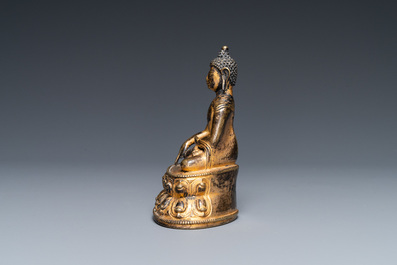 A Sino-Tibetan gilt bronze figure of Buddha Shakyamuni, 17th C.