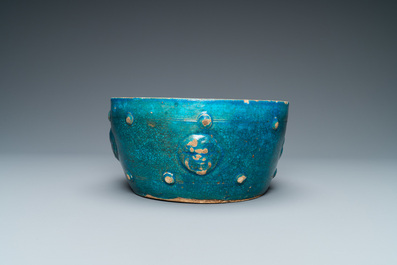 A Chinese monochrome turquoise-glazed bowl with reticulated wooden cover, Ming