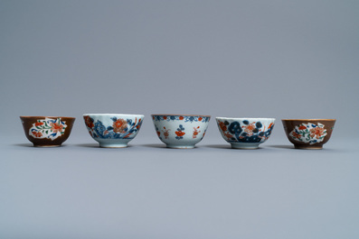 A Chinese Imari-style porringer, a mug, a bowl and five cups and saucers, Kangxi/Qianlong