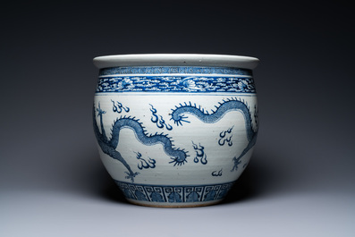 A Chinese blue and white 'dragons' fish bowl, Qianlong/Jiaqing