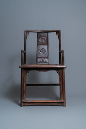 A pair of Chinese carved wooden chairs with wicker seats, 19th C.