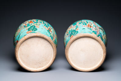 A pair of large Chinese turquoise-ground famille verte vases and covers, 19th C.