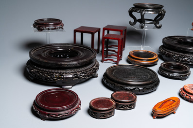 A varied collection of Chinese wooden stands, 19/20th C.