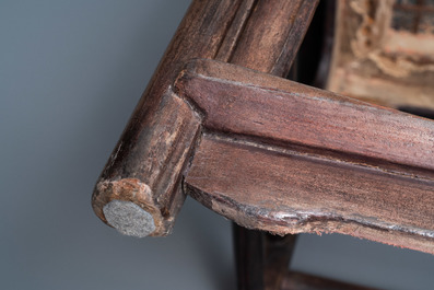 A pair of Chinese carved wooden chairs with wicker seats, 19th C.