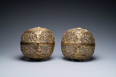 A pair of reticulated Tibetan copper incense balls, 17/18th C.