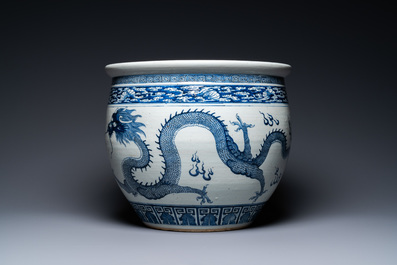 A Chinese blue and white 'dragons' fish bowl, Qianlong/Jiaqing