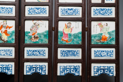 A Chinese five-fold wooden screen with famille rose plaques, 19th C.