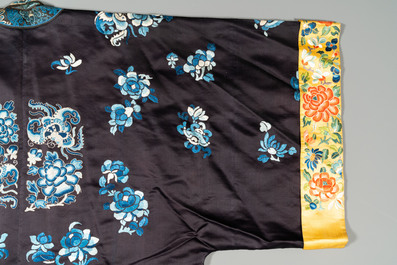 A Chinese 'forbidden stitch' embroidered silk ladies robe with flowers and butterflies, 19th C.