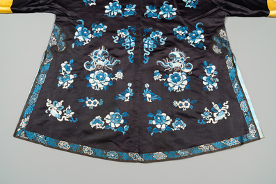 A Chinese 'forbidden stitch' embroidered silk ladies robe with flowers and butterflies, 19th C.