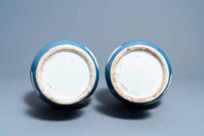 A pair of Chinese white slip-decorated blue-ground vases, 19th C.