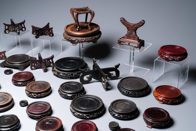 A varied collection of Chinese wooden stands, 19/20th C.