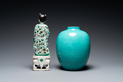 A Chinese verte biscuit figure, a green 'lotus' jar and a figurative blue and white plate, Kangxi and later