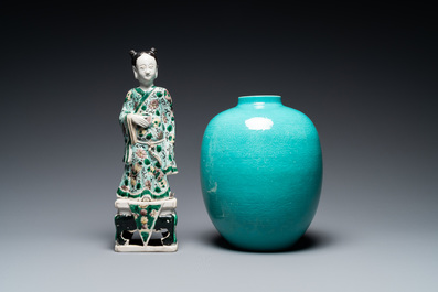 Een Chinese famille verte biscuit figuur, een groene 'lotus' pot en een blauw-wit bord met figuratief decor, Kangxi en later