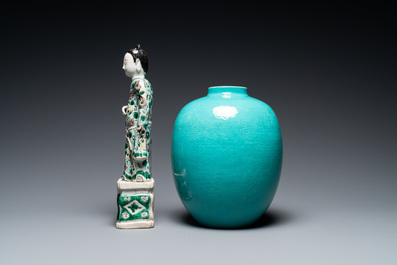 A Chinese verte biscuit figure, a green 'lotus' jar and a figurative blue and white plate, Kangxi and later