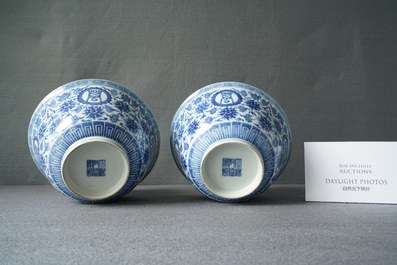 A pair of Chinese blue and white 'wan shou wu jiang' bowls, Qianlong mark and of the period