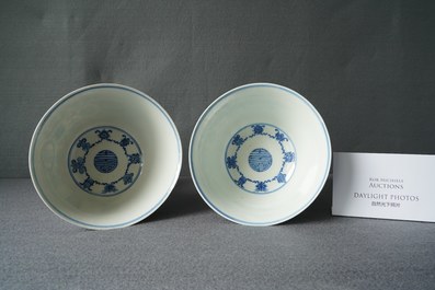 A pair of Chinese blue and white 'wan shou wu jiang' bowls, Qianlong mark and of the period