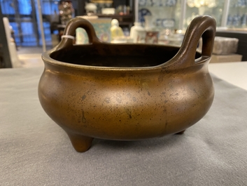 A Chinese bronze tripod censer, Xuande mark, 18th C.