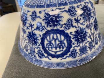 A pair of Chinese blue and white 'wan shou wu jiang' bowls, Qianlong mark and of the period