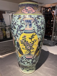 A very large Chinese famille rose turquoise-ground vase and cover, 19th C.