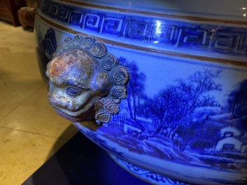 A large Chinese blue and white fish bowl with landscape design, Qianlong