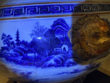 A large Chinese blue and white fish bowl with landscape design, Qianlong