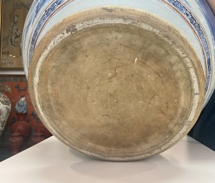 A large Chinese blue and white fish bowl with landscape design, Qianlong