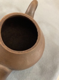 Four Chinese Yixing stoneware, blue and white and monochrome black porcelain teapots, Kangxi and later