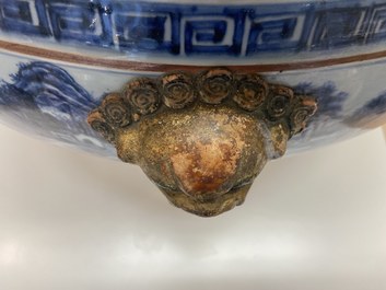 A large Chinese blue and white fish bowl with landscape design, Qianlong