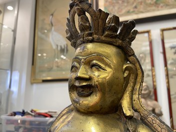 Een Chinese vergulde bronzen figuur van een zittende Boeddha, Ming