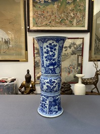 A Chinese blue and white 'gu' vase with floral and lanscape panels, Kangxi