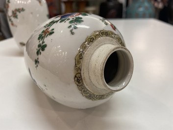 A pair of Chinese famille verte jars with birds among blossoming branches, Kangxi