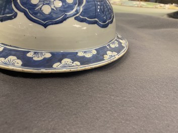 A pair of large Chinese blue and white covered vases, 19th C.