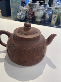 Two Chinese Yixing stoneware teapots and a famille rose 'Shou Lao' group, Kangxi and 20th C.