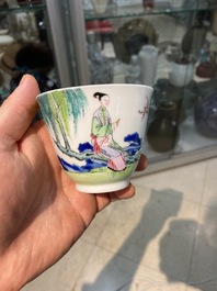 A Chinese famille rose cup and saucer with ladies and a boy playing with a rabbit, Yongzheng