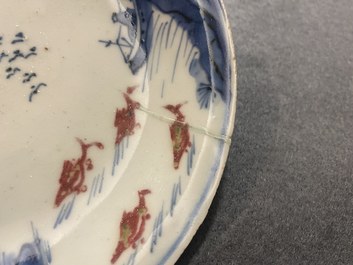 Two Chinese blue, white and copper-red 'fish' plates, Transitional period