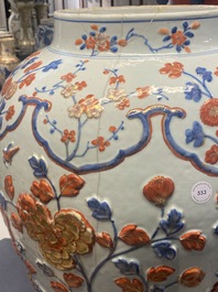 An exceptionally large Chinese Imari-style vase and cover with molded floral design, Kangxi