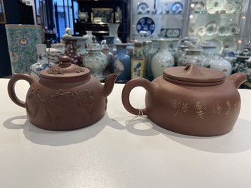 Two Chinese Yixing stoneware teapots and a famille rose 'Shou Lao' group, Kangxi and 20th C.