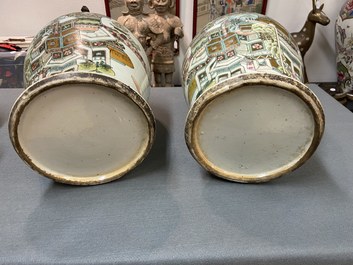 A pair of Chinese qianjiang cai vases and covers with antiquities, 19/20th C.