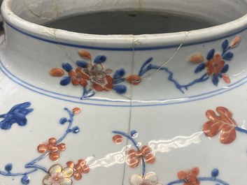 An exceptionally large Chinese Imari-style vase and cover with molded floral design, Kangxi